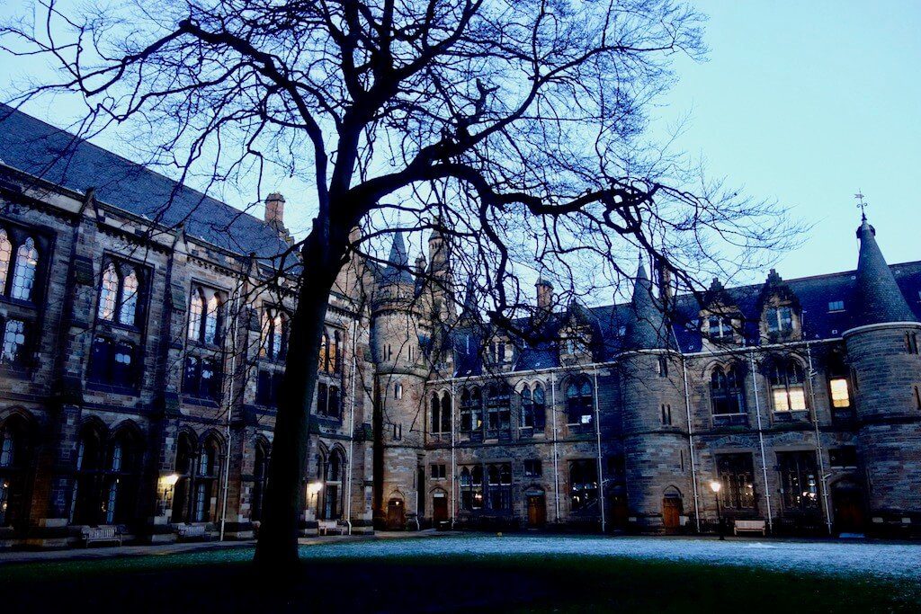 view of a courtyard at glasgow university at dusk