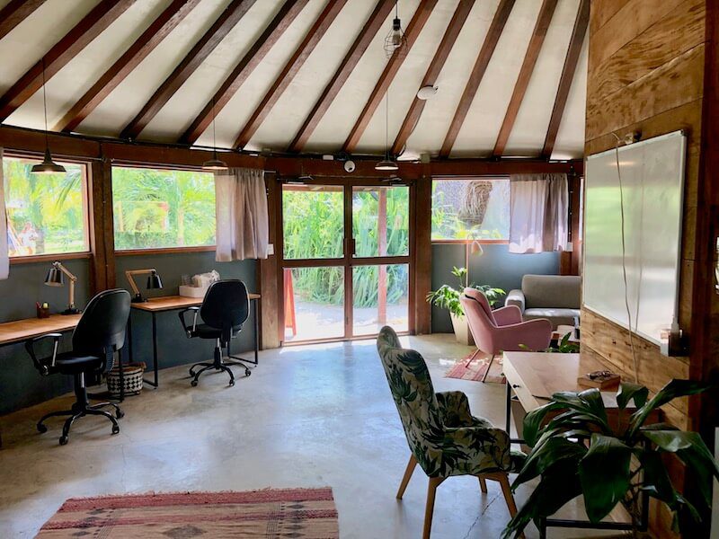 The Selina Playa Venao Coworking Space, a round building with desks and comfortable chairs with natural light