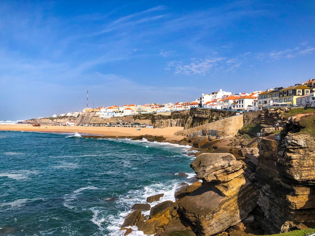 Blue ocean and yellow sand at Praia dos Pescadores in central Ericeira