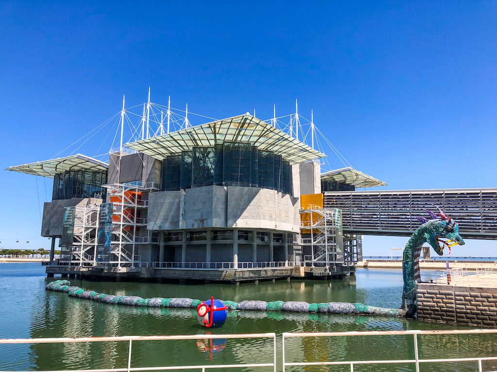 The Lisbon aquarium with a dragon sculpture in front
