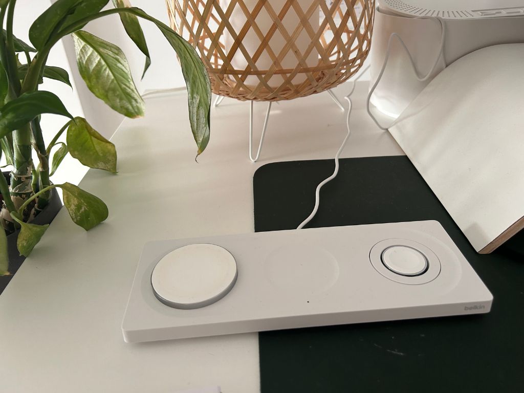 A white Belkin charging station with space for a phone, Airpods, and apple watch