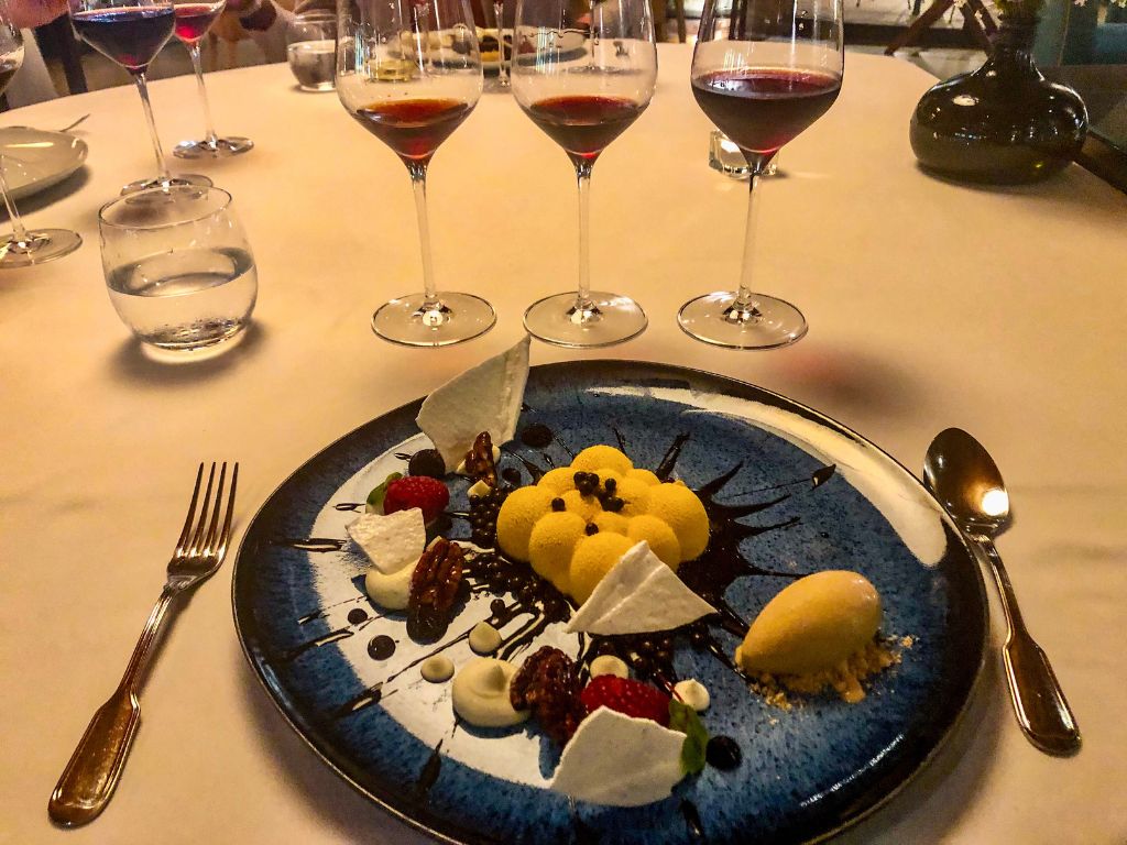 Fancy dessert with three glasses of Port wine at the Taylor Wine Caves in Porto