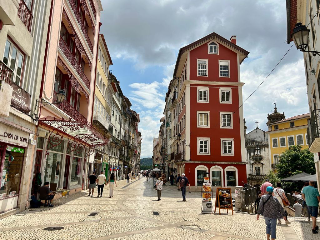 A beautiful red building on the main street in Coimbra